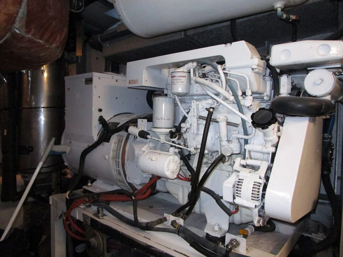 The image showcases the yacht's engine room with a detailed view of the machinery and components. aboard SHEPSL X Yacht for Sale