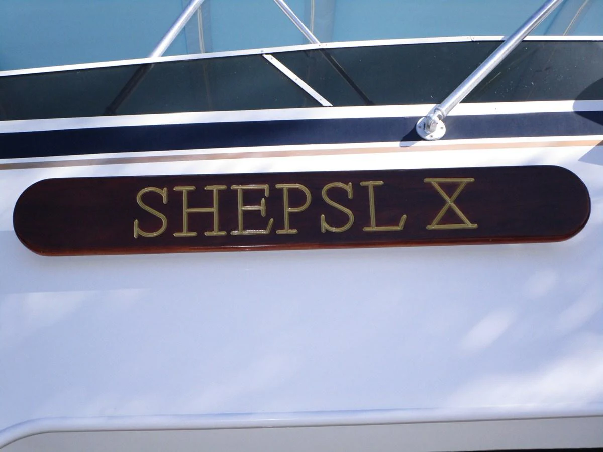 A close-up of the yacht's nameplate displaying 'SHEPSL X'. aboard SHEPSL X Yacht for Sale