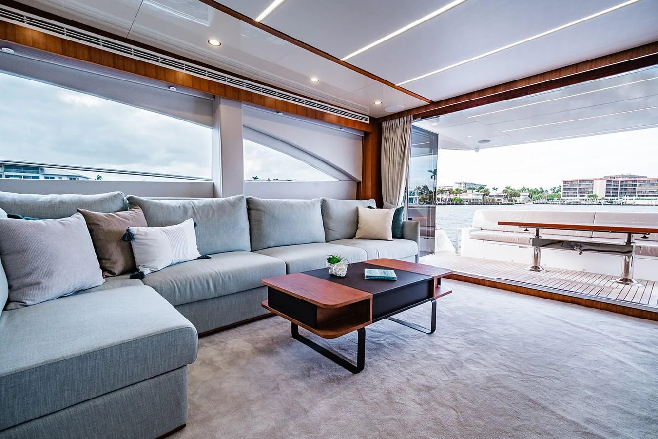 The salon features a spacious and comfortable seating area with a modern design and ample natural light. aboard INDIGO Yacht for Sale