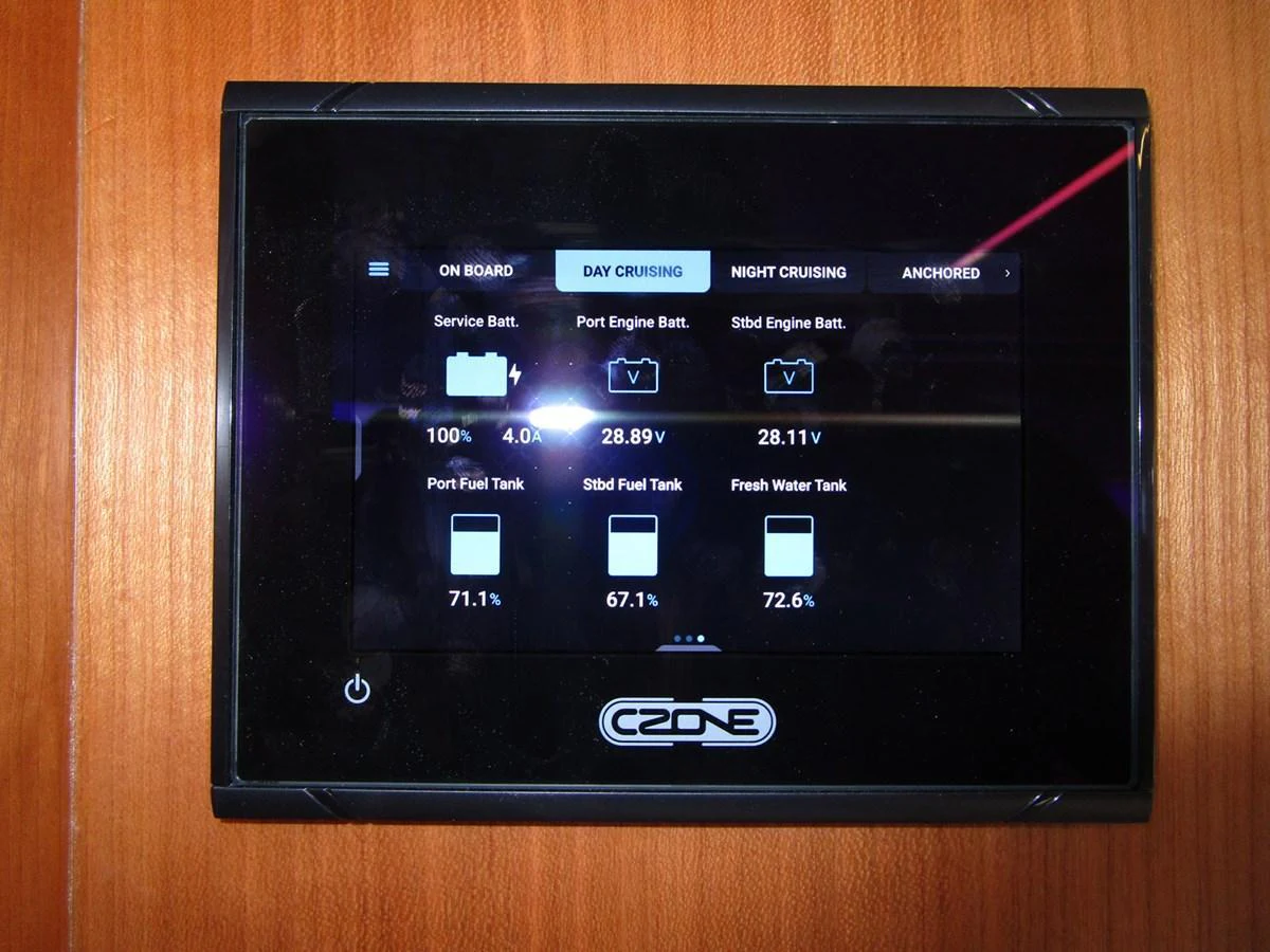 The image showcases a digital control panel displaying various yacht systems and statuses. aboard INDIGO Yacht for Sale