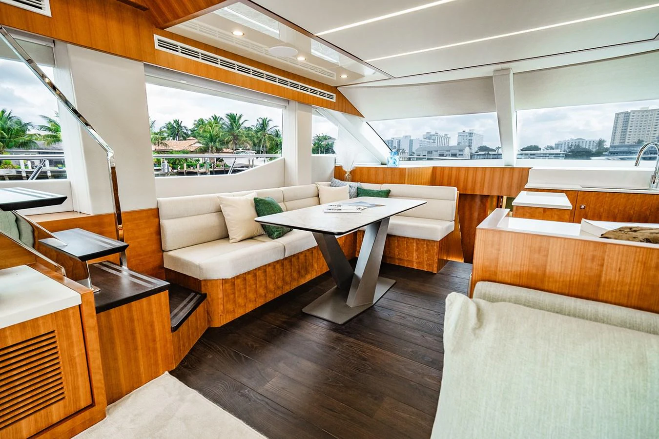 The yacht's salon features a modern and inviting seating area with large windows offering scenic views. aboard INDIGO Yacht for Sale