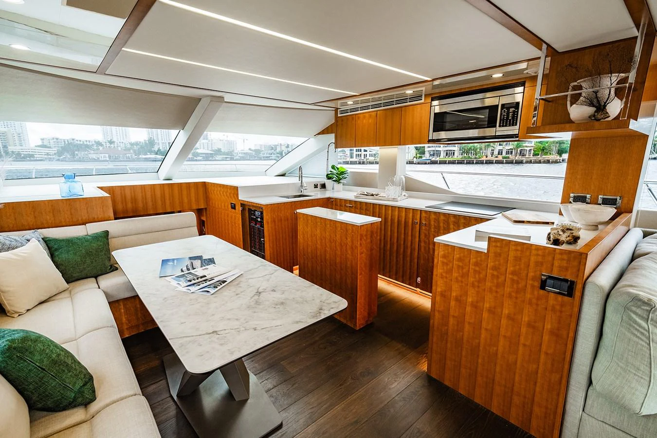 The yacht's galley features modern appliances and a cozy dining area with a view. aboard INDIGO Yacht for Sale
