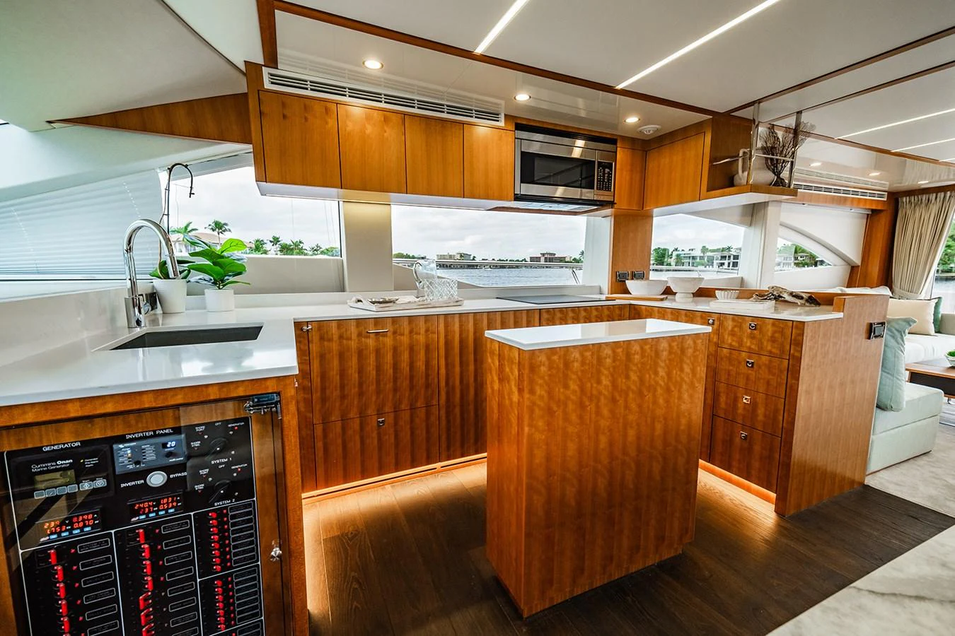 The galley features modern appliances and elegant wood cabinetry, creating a warm and inviting space for culinary endeavors. aboard INDIGO Yacht for Sale
