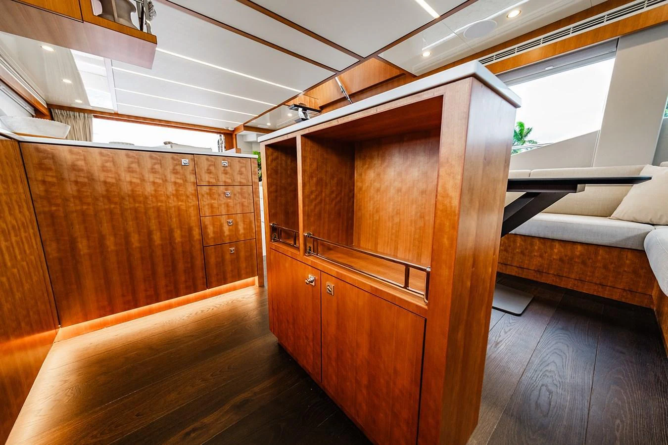 The yacht's interior features elegant wood cabinetry and modern furnishings. aboard INDIGO Yacht for Sale