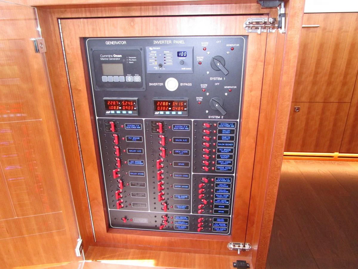 A detailed view of the yacht's generator and inverter panel, showcasing its advanced electrical systems. aboard INDIGO Yacht for Sale
