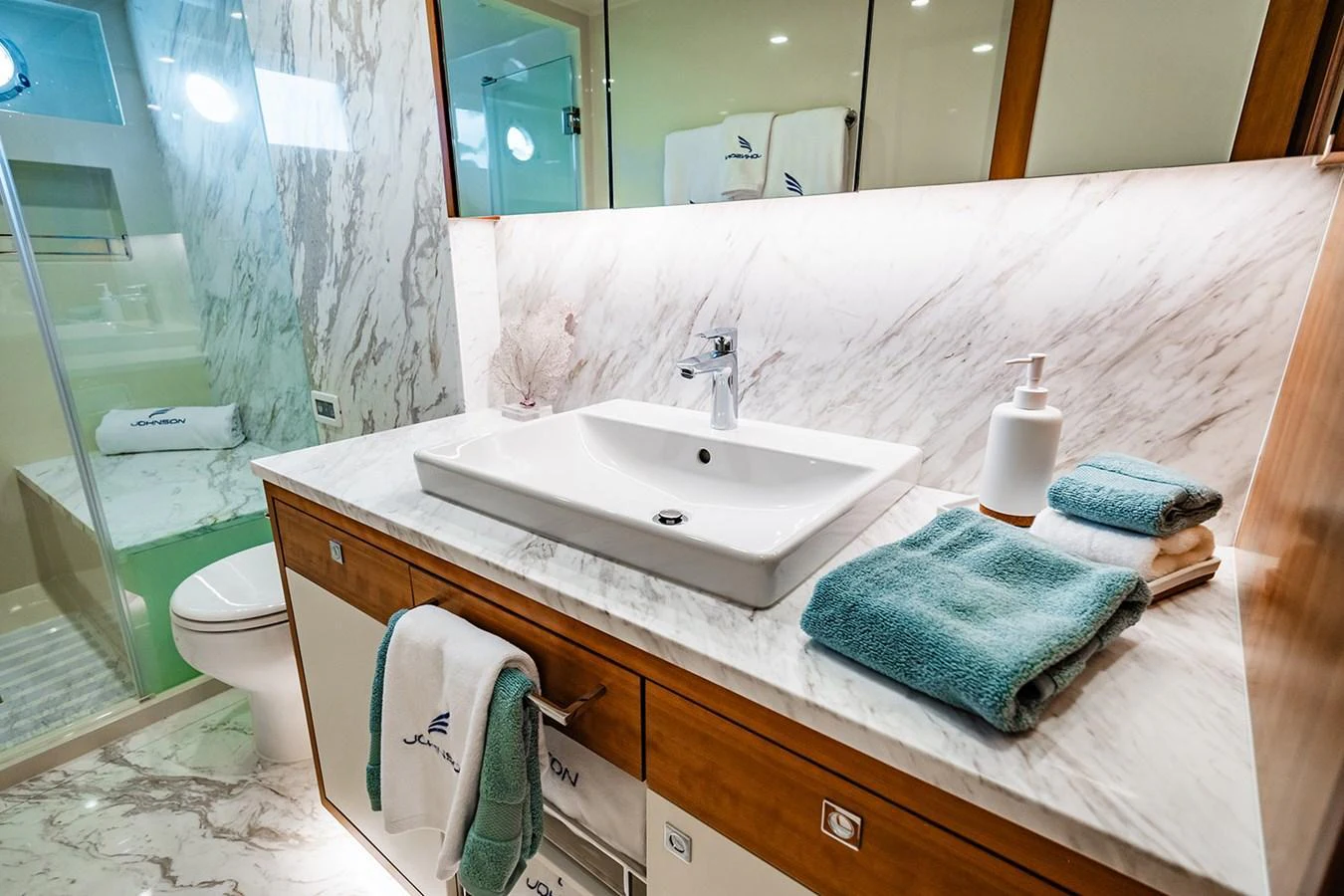 The yacht's bathroom features elegant marble surfaces and modern fixtures. aboard INDIGO Yacht for Sale
