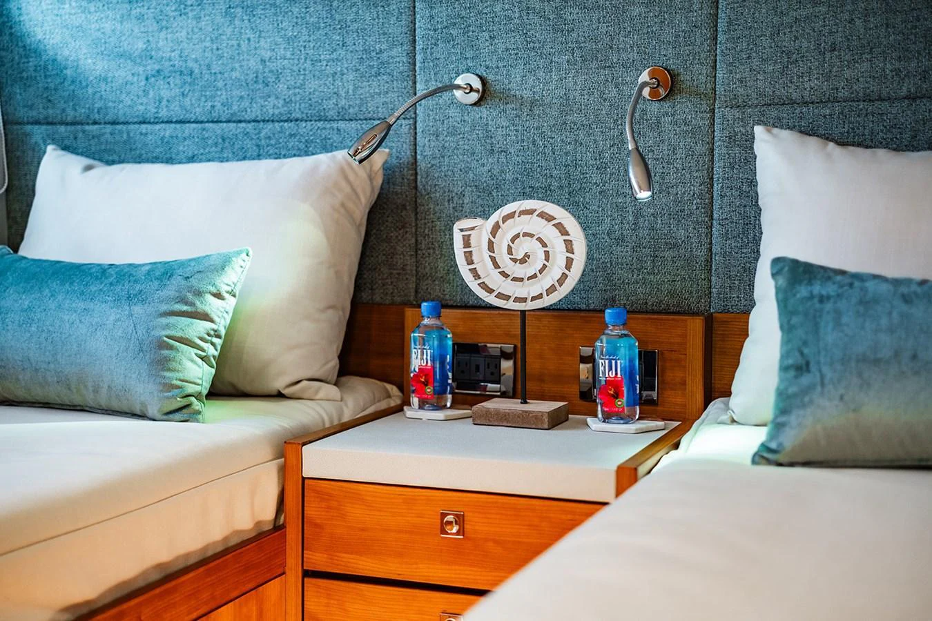 The guest stateroom features twin beds and modern amenities for a comfortable stay. aboard INDIGO Yacht for Sale