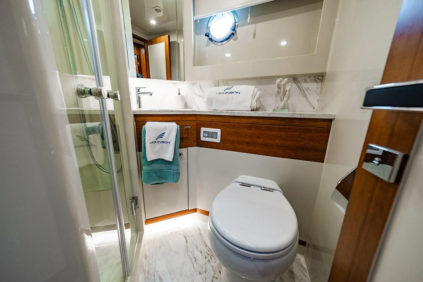 The yacht's bathroom features modern fixtures and elegant finishes, creating a luxurious and comfortable space. aboard INDIGO Yacht for Sale