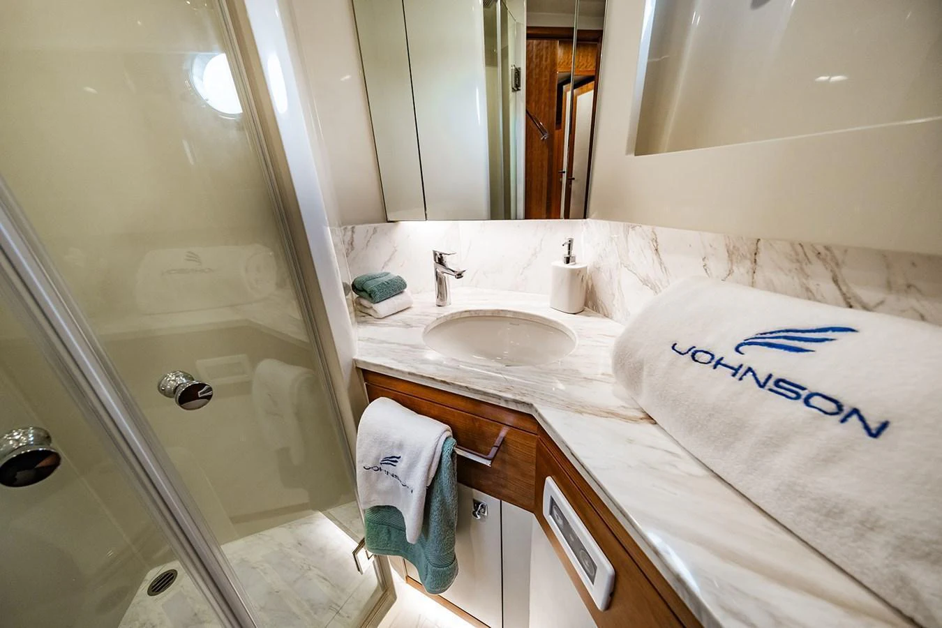 The yacht's bathroom features elegant marble countertops and modern fixtures. aboard INDIGO Yacht for Sale