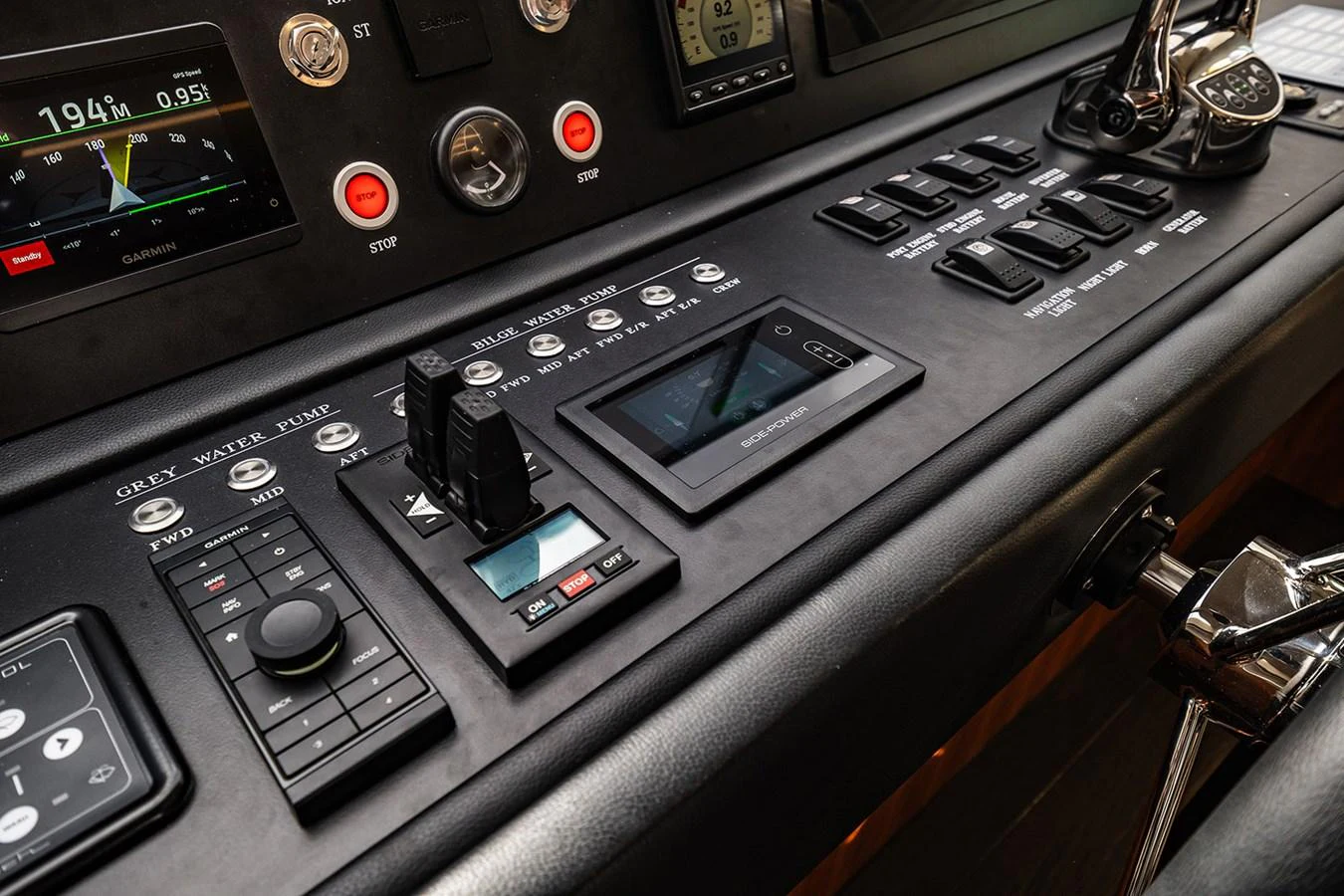 A close-up view of the yacht's helm showcasing advanced navigation and control systems. aboard INDIGO Yacht for Sale