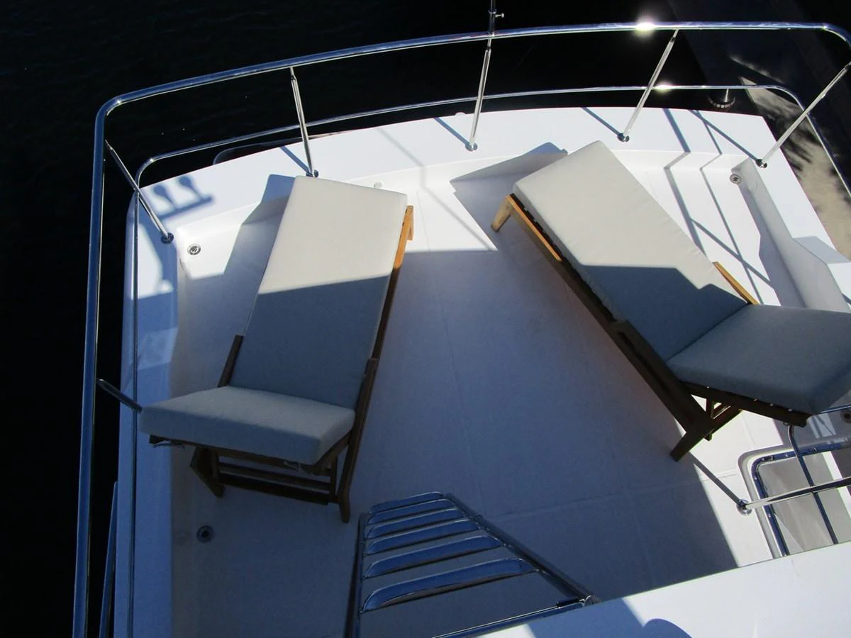 The sundeck features comfortable lounge chairs for relaxation. aboard INDIGO Yacht for Sale