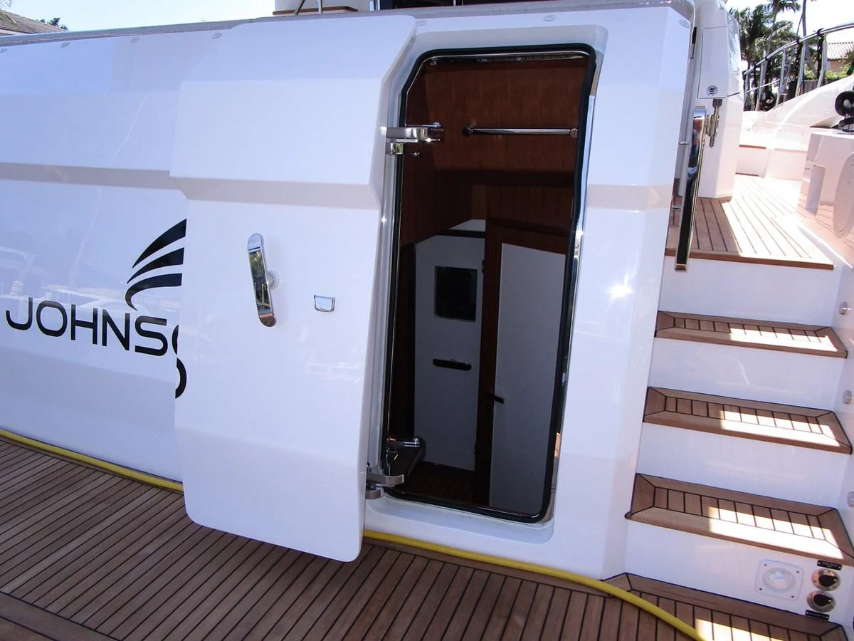 The image showcases a side entry door on the yacht, leading to the interior from the deck. aboard INDIGO Yacht for Sale