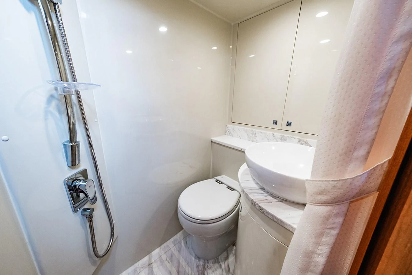 The yacht's bathroom features modern fixtures and a sleek design. aboard INDIGO Yacht for Sale