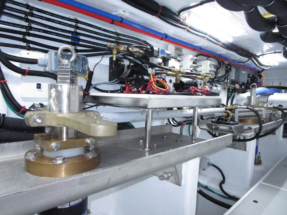 The image showcases the intricate mechanical and electrical systems within the yacht's engine room. aboard INDIGO Yacht for Sale