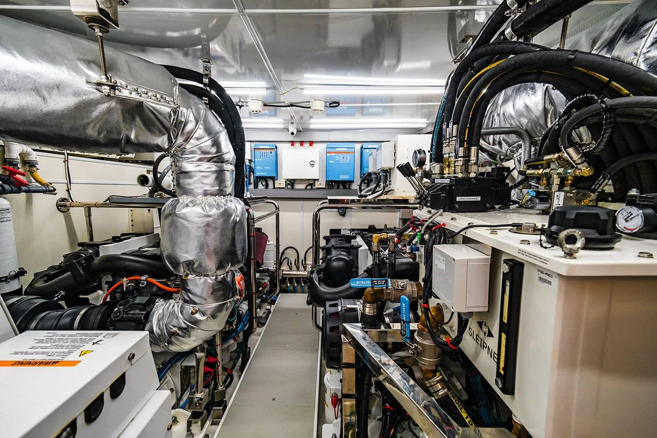 The image showcases the yacht's well-organized engine room with advanced machinery and equipment. aboard INDIGO Yacht for Sale