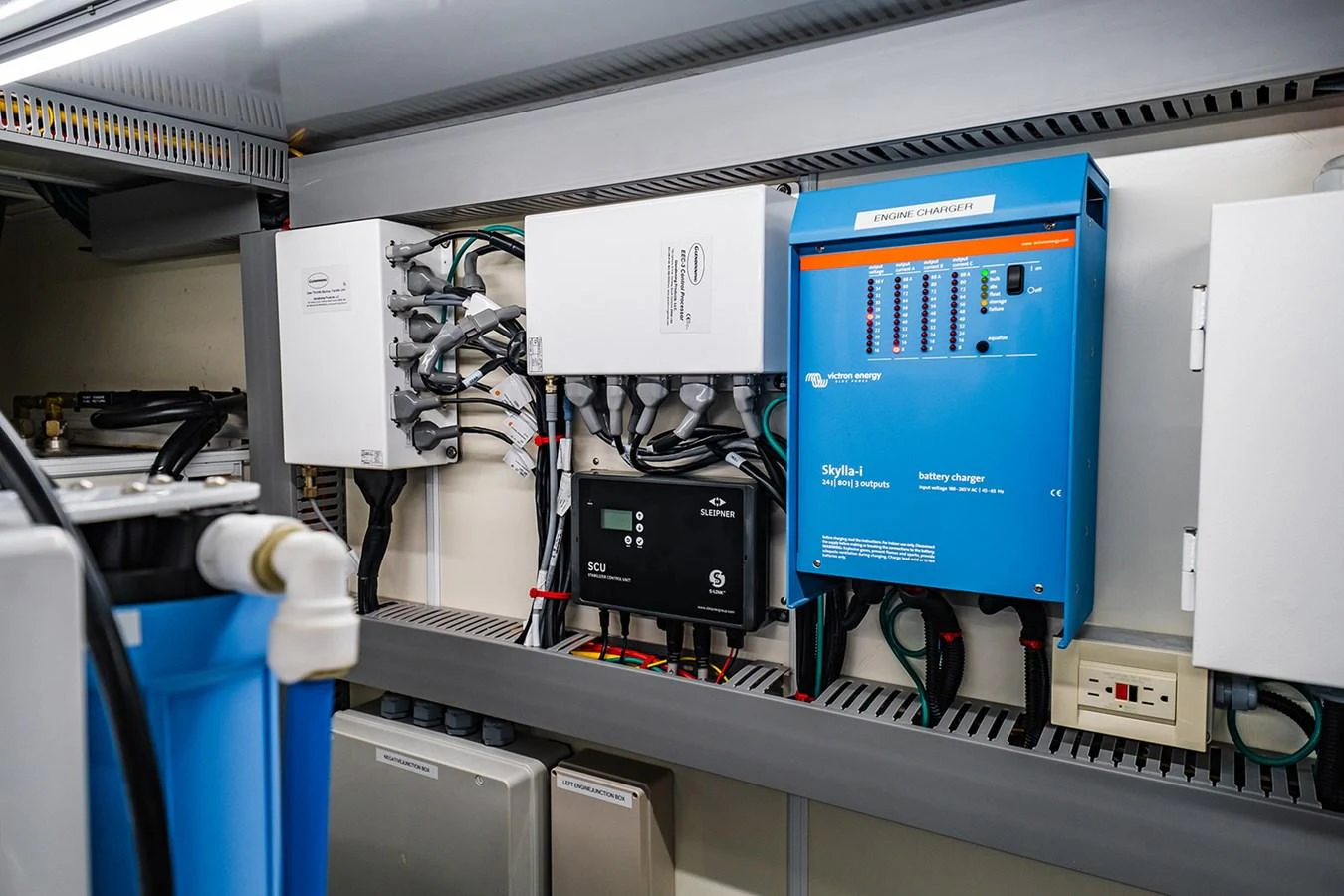The image showcases the yacht's technical equipment and electrical systems in a well-organized compartment. aboard INDIGO Yacht for Sale