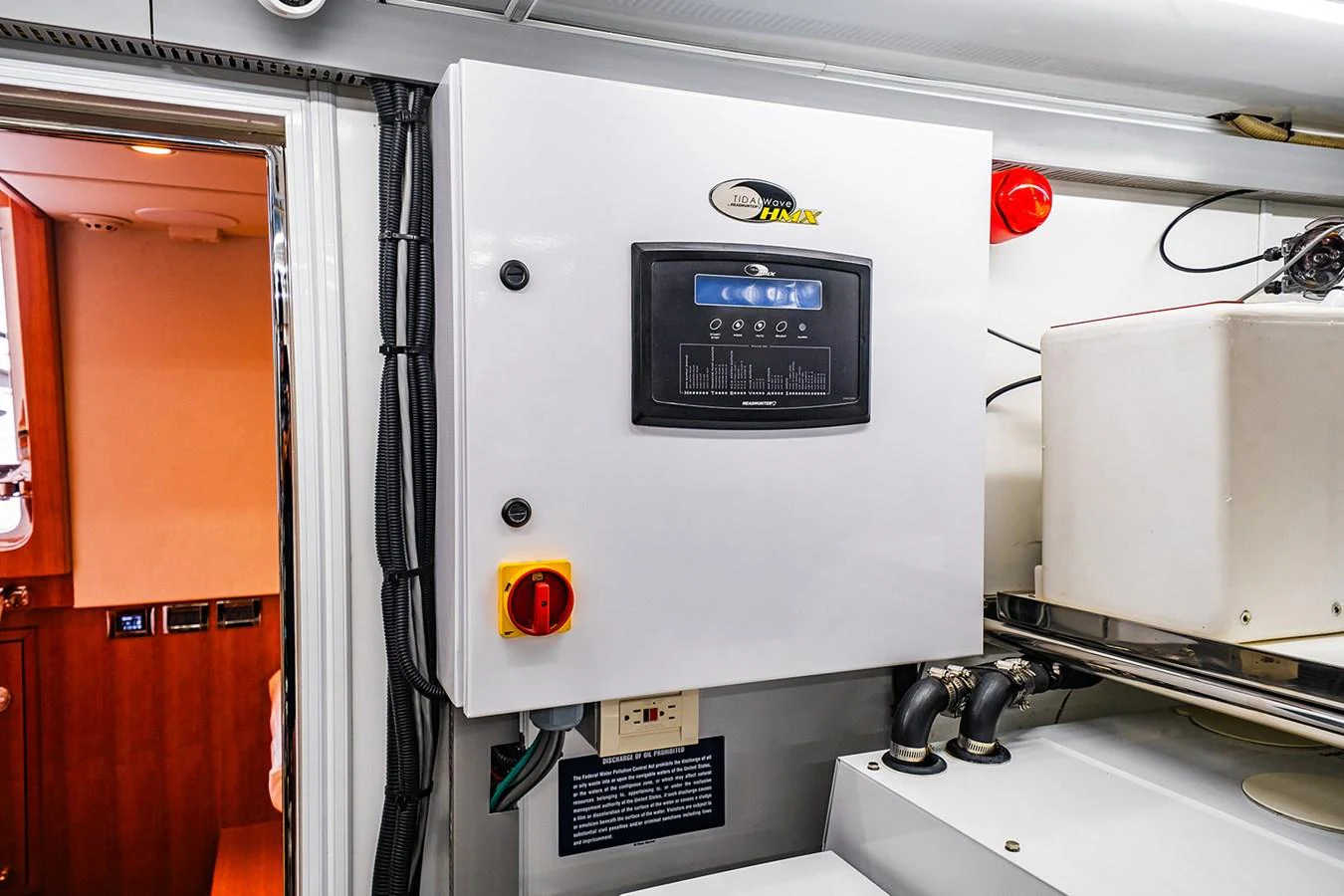 The image shows a detailed view of the yacht's electrical control panel in a technical area. aboard INDIGO Yacht for Sale