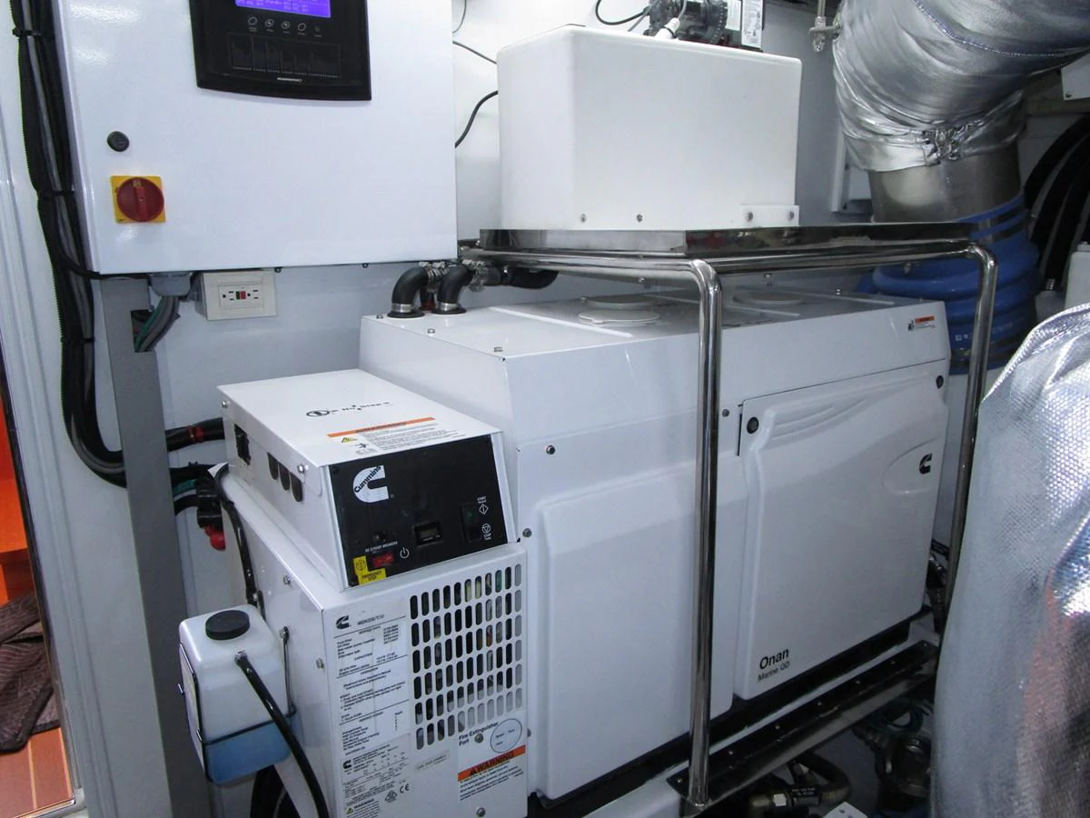 The image shows the yacht's engine room with machinery and equipment. aboard INDIGO Yacht for Sale