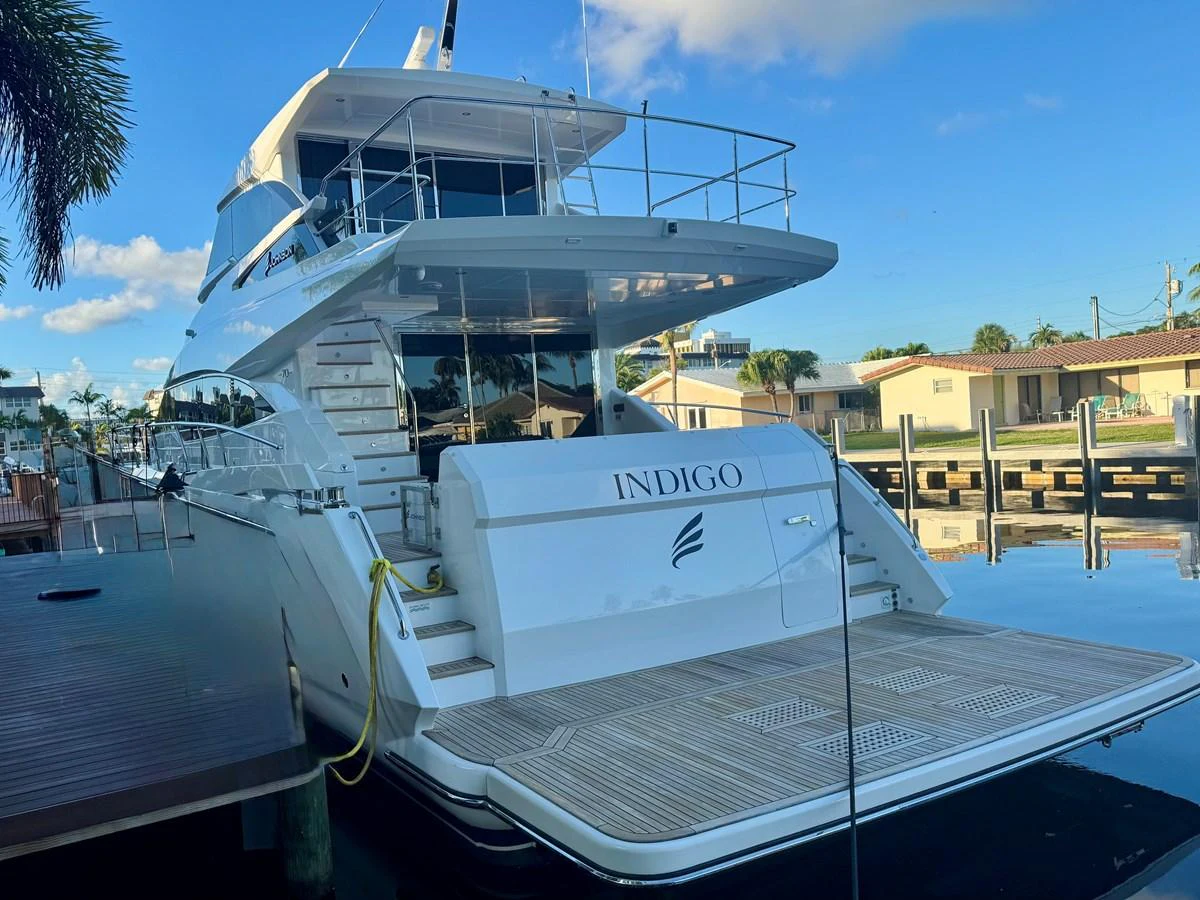 The yacht's aft deck showcases a spacious and inviting area for relaxation and entertainment. aboard INDIGO Yacht for Sale