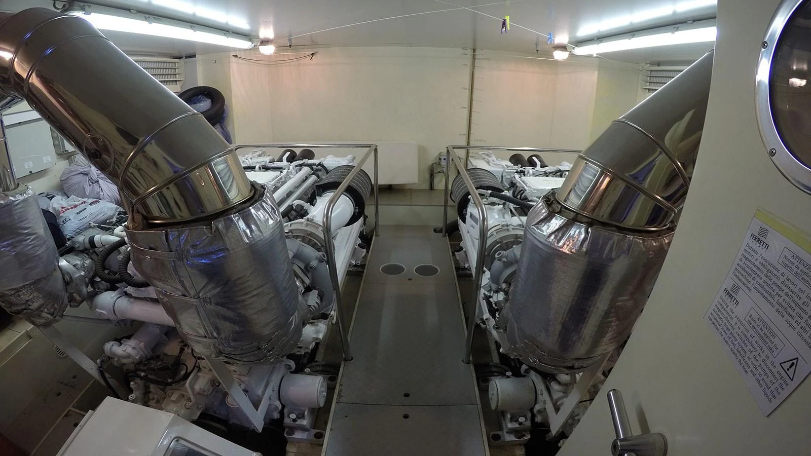 The image showcases the yacht's engine room with well-maintained machinery and equipment. aboard QUIT Yacht for Sale