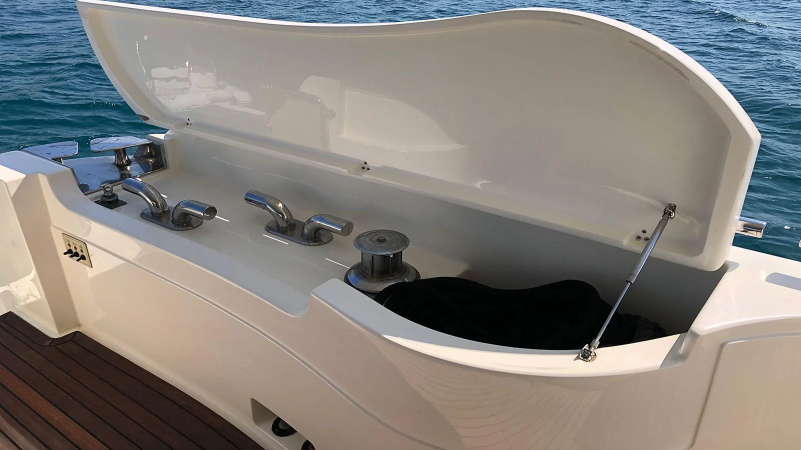 A close-up view of a yacht's storage compartment with various equipment. aboard QUIT Yacht for Sale
