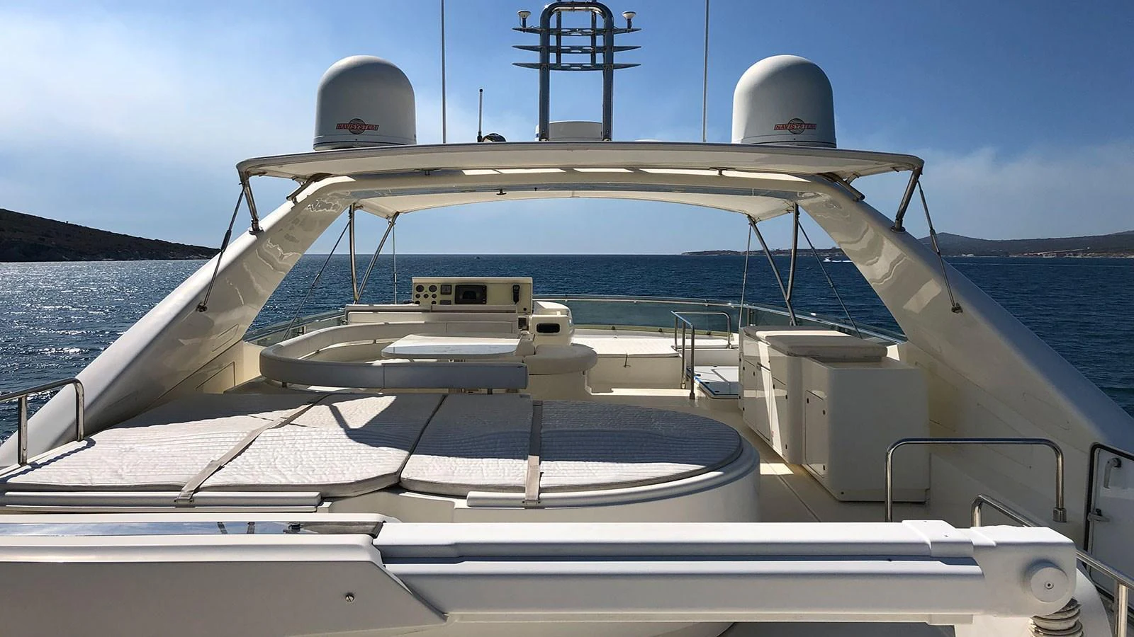 The flybridge offers a spacious and inviting area for relaxation and navigation with stunning sea views. aboard QUIT Yacht for Sale