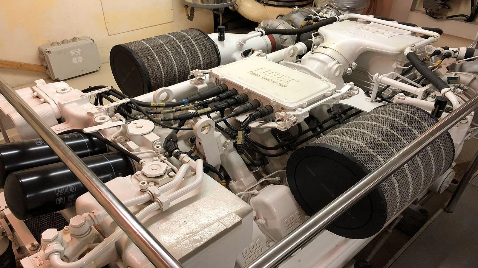 The image showcases the intricate and powerful machinery within the yacht's engine room. aboard QUIT Yacht for Sale