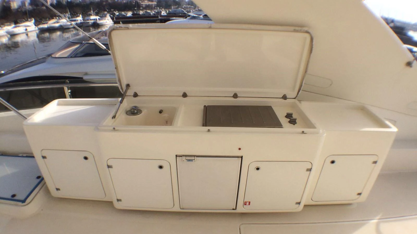 The yacht features a well-equipped outdoor galley with a sink and grill, perfect for alfresco dining. aboard QUIT Yacht for Sale