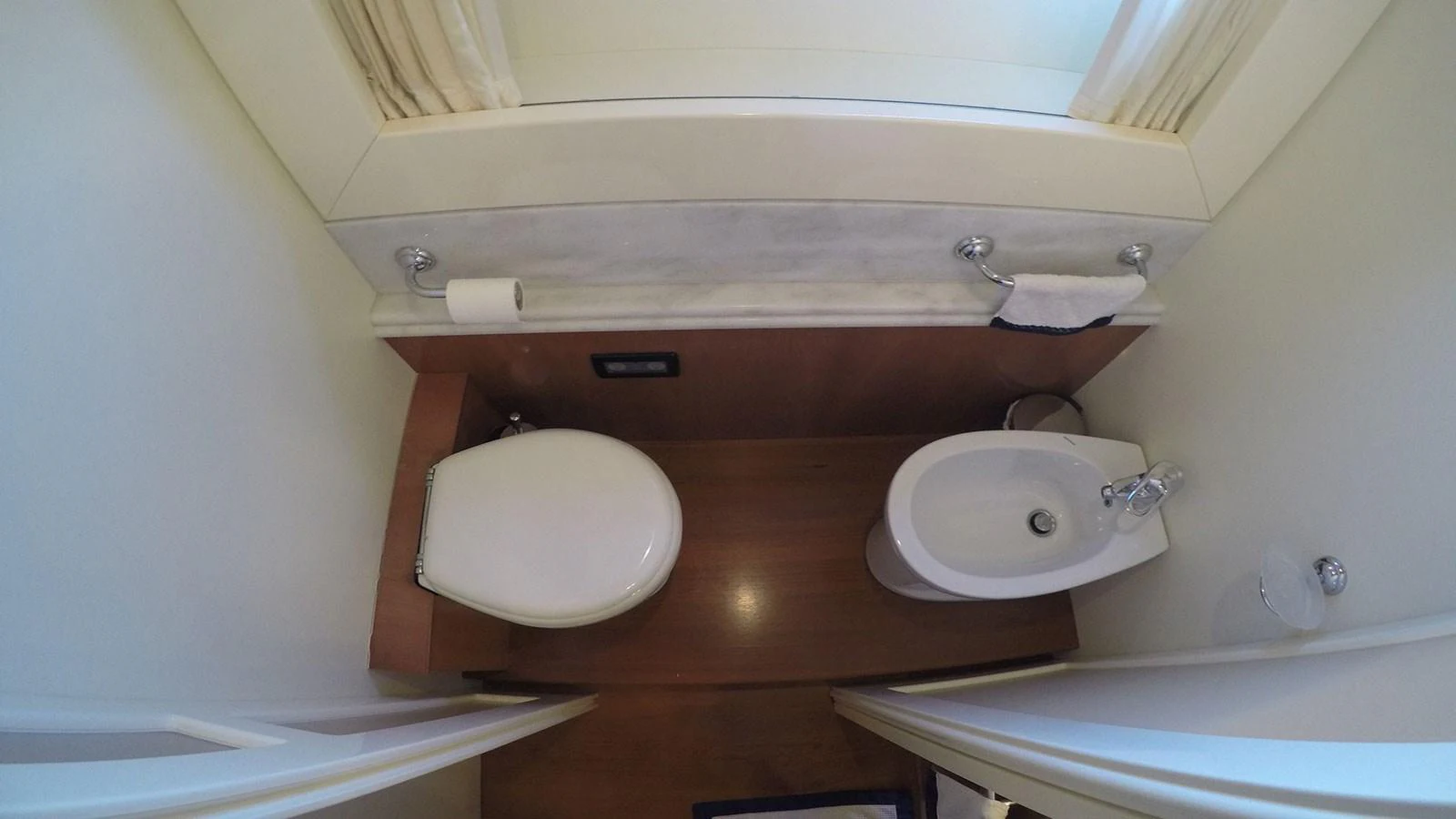 A compact and well-appointed yacht bathroom with modern fixtures. aboard QUIT Yacht for Sale
