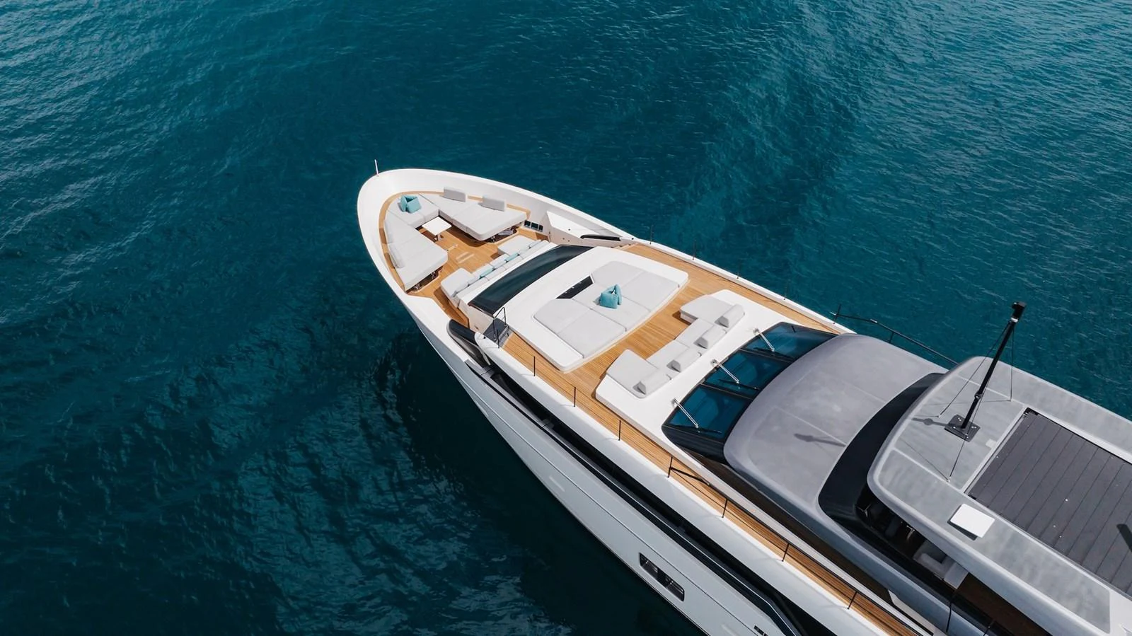 The yacht's sleek foredeck features luxurious sunbathing areas and a modern design. aboard AMBAR Yacht for Sale