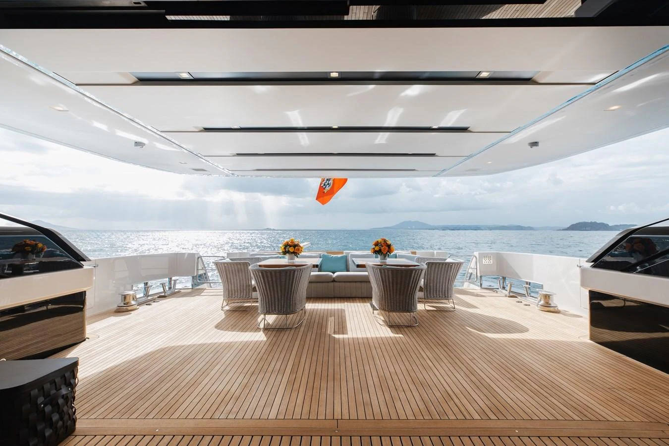 The aft deck offers a spacious and elegant area for relaxation and dining with stunning ocean views. aboard AMBAR Yacht for Sale