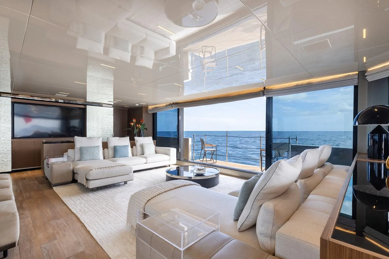 The salon offers a spacious and luxurious seating area with panoramic ocean views. aboard AMBAR Yacht for Sale