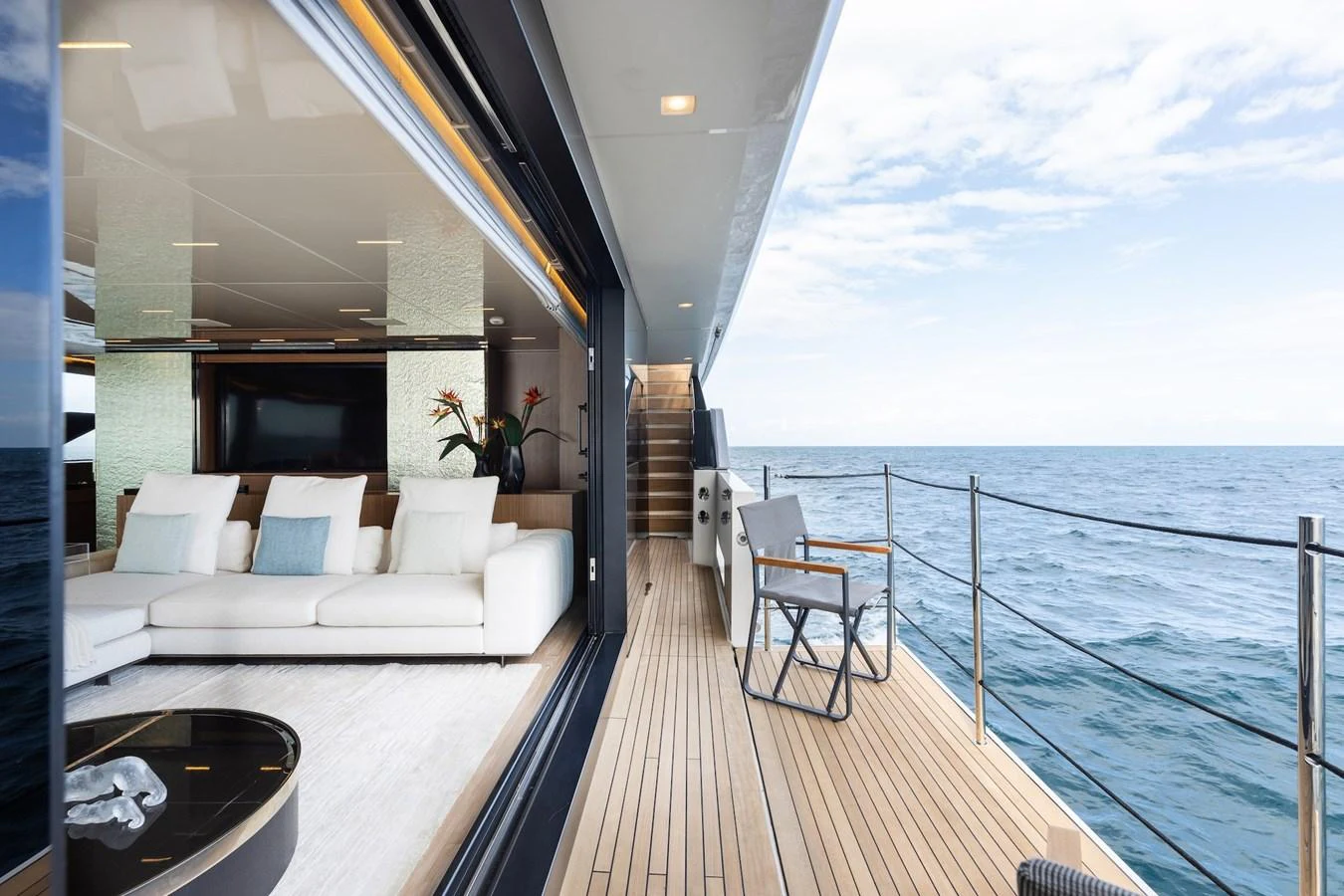 The aft deck offers a seamless transition between indoor and outdoor living spaces with stunning ocean views. aboard AMBAR Yacht for Sale