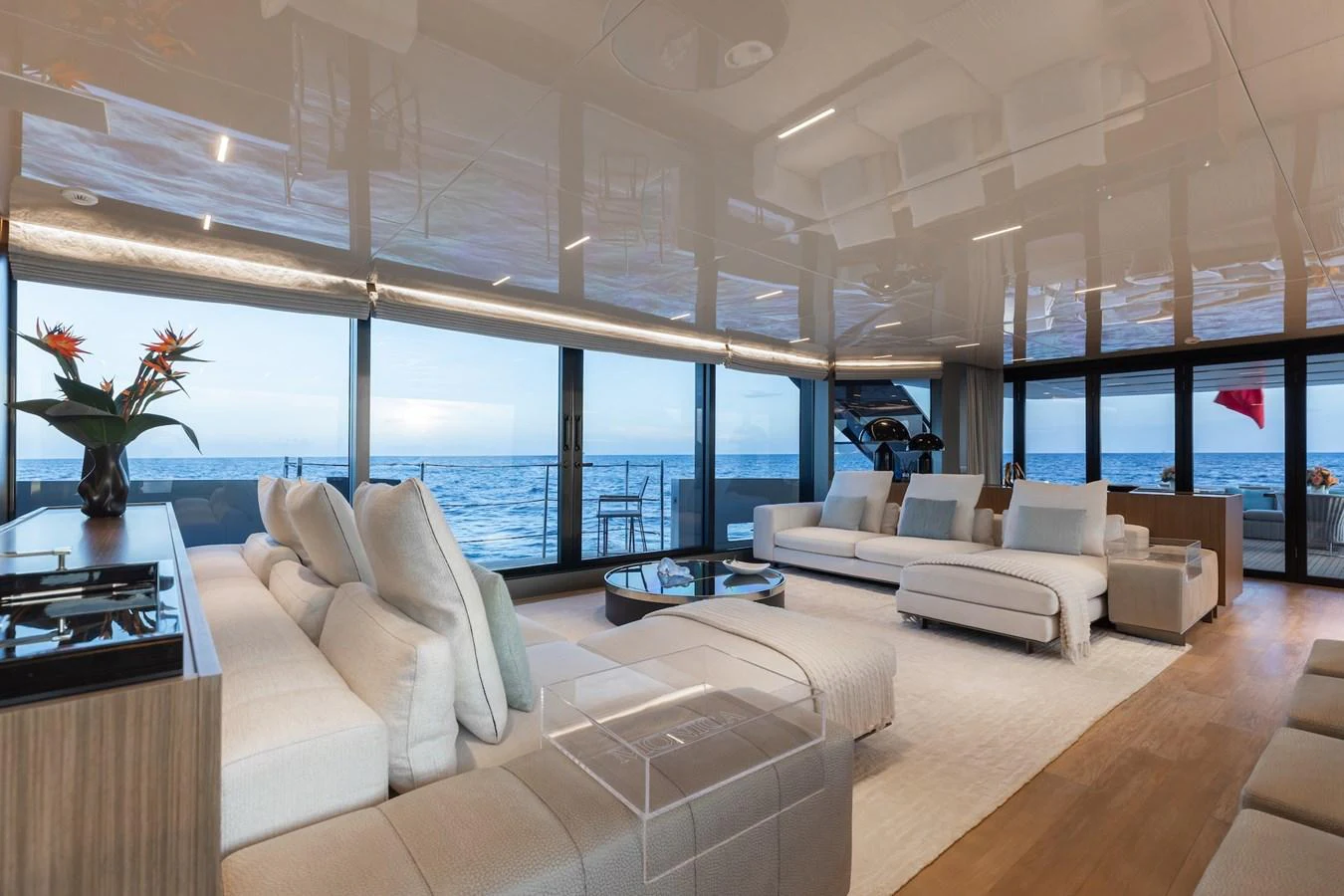 The salon offers a luxurious and spacious area with panoramic ocean views and elegant furnishings. aboard AMBAR Yacht for Sale