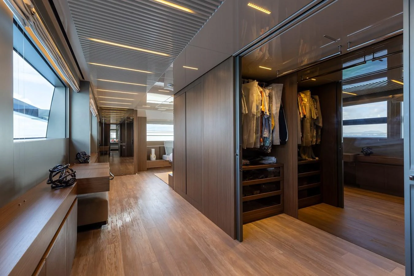 A spacious walk-in closet with ample storage and modern design. aboard AMBAR Yacht for Sale