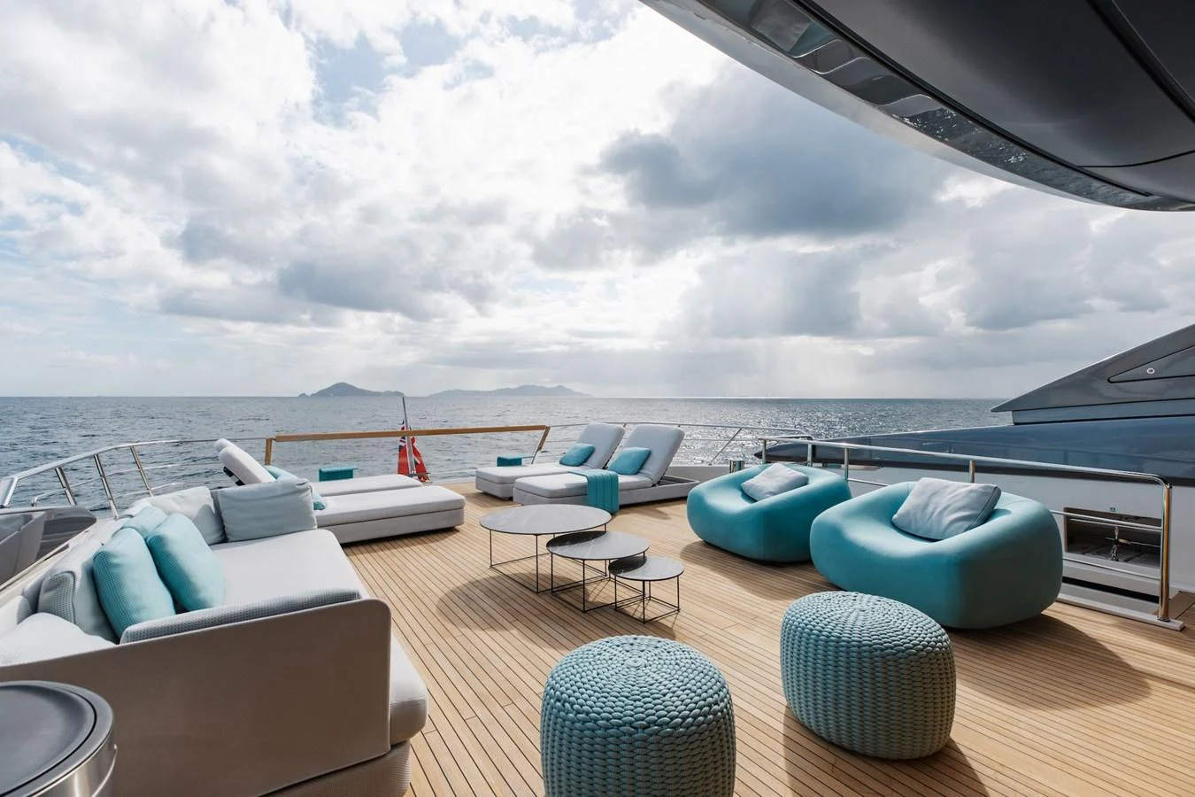 The aft deck offers a luxurious lounging area with plush seating and stunning ocean views. aboard AMBAR Yacht for Sale