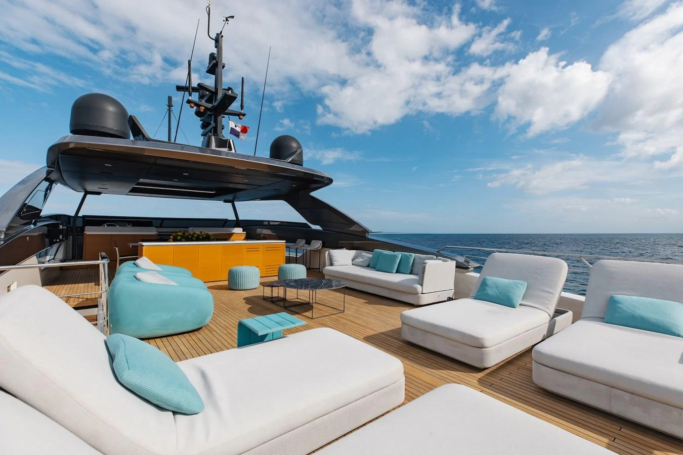 The sundeck offers luxurious lounging with plush seating and stunning ocean views. aboard AMBAR Yacht for Sale