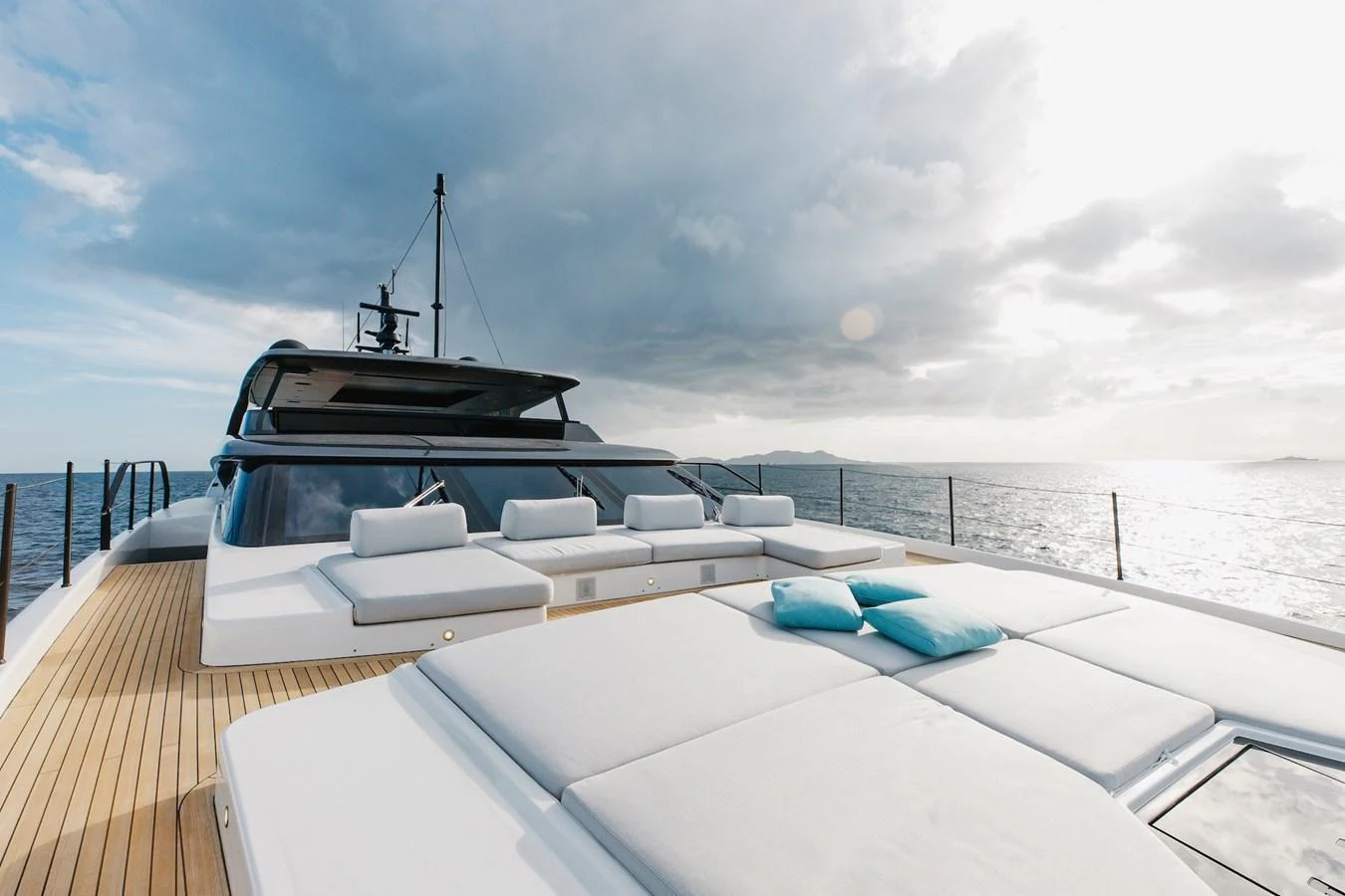 The yacht's sundeck offers a luxurious lounging area with plush sunbeds and scenic ocean views. aboard AMBAR Yacht for Sale