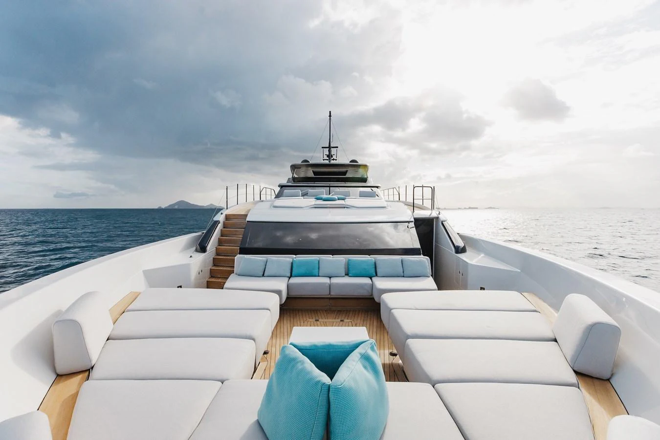 The yacht's sundeck offers a luxurious lounging area with plush seating and stunning ocean views. aboard AMBAR Yacht for Sale