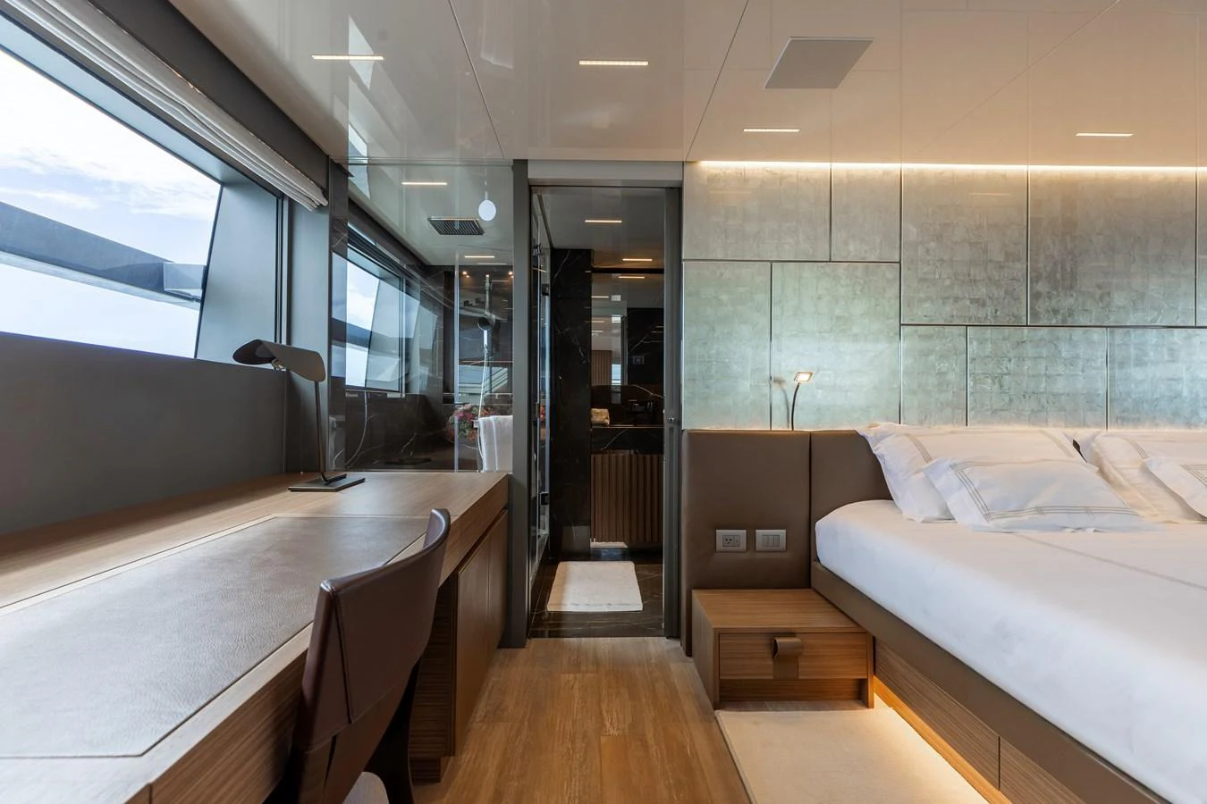 The stateroom features a modern design with a spacious layout and luxurious furnishings. aboard AMBAR Yacht for Sale