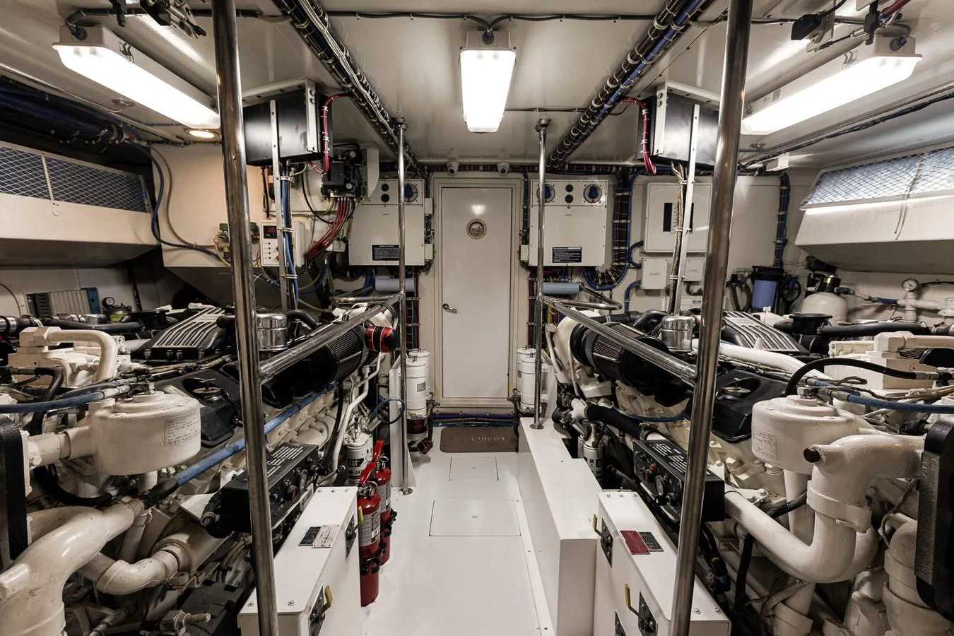 The engine room showcases a well-organized and meticulously maintained space with advanced machinery. aboard KRISTIN LEE Yacht for Sale