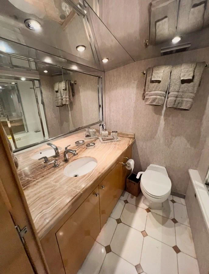 A luxurious yacht bathroom featuring elegant fixtures and a sophisticated design. aboard KRISTIN LEE Yacht for Sale