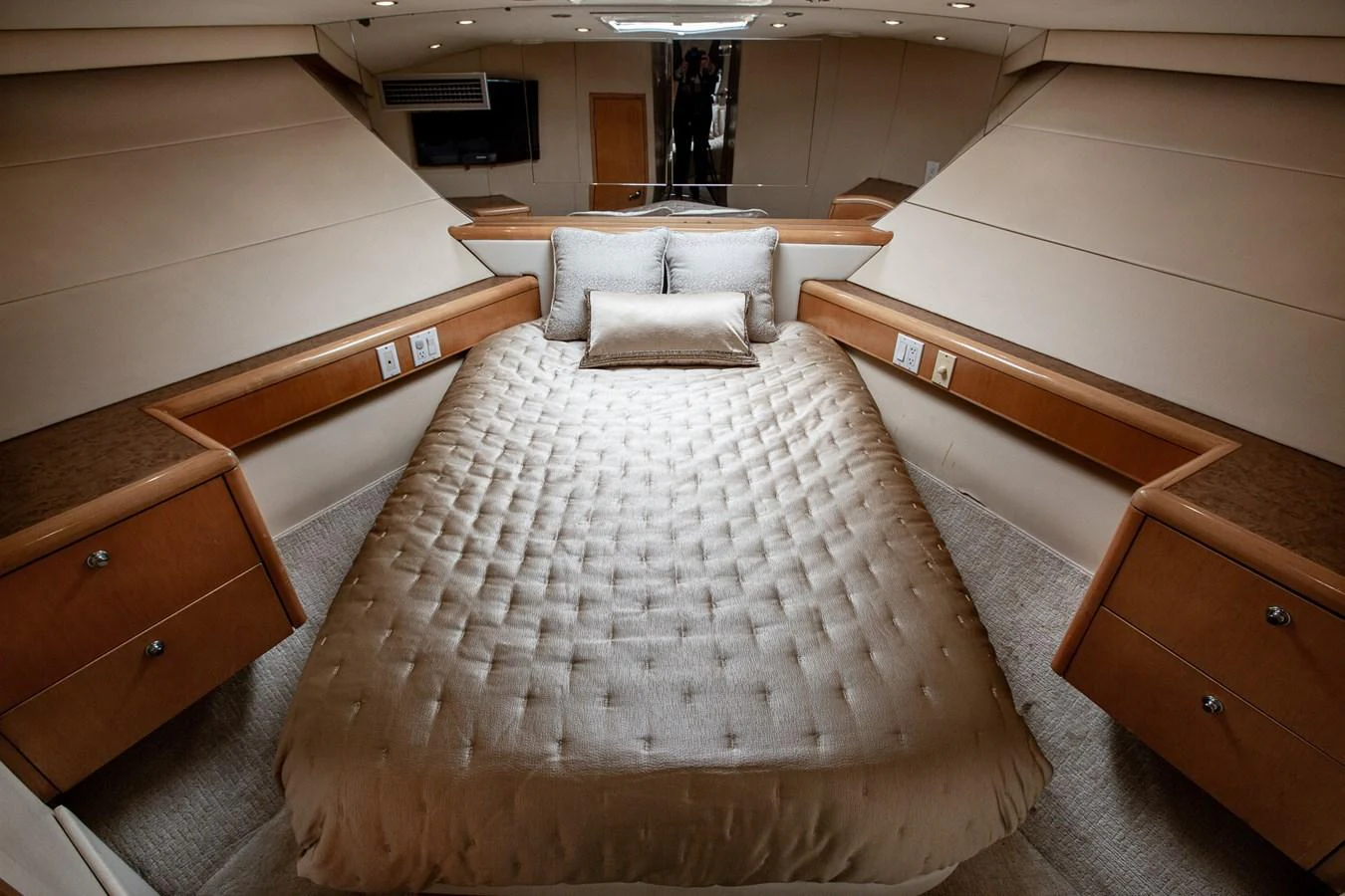The stateroom features a luxurious bed with elegant bedding and ample storage space. aboard KRISTIN LEE Yacht for Sale