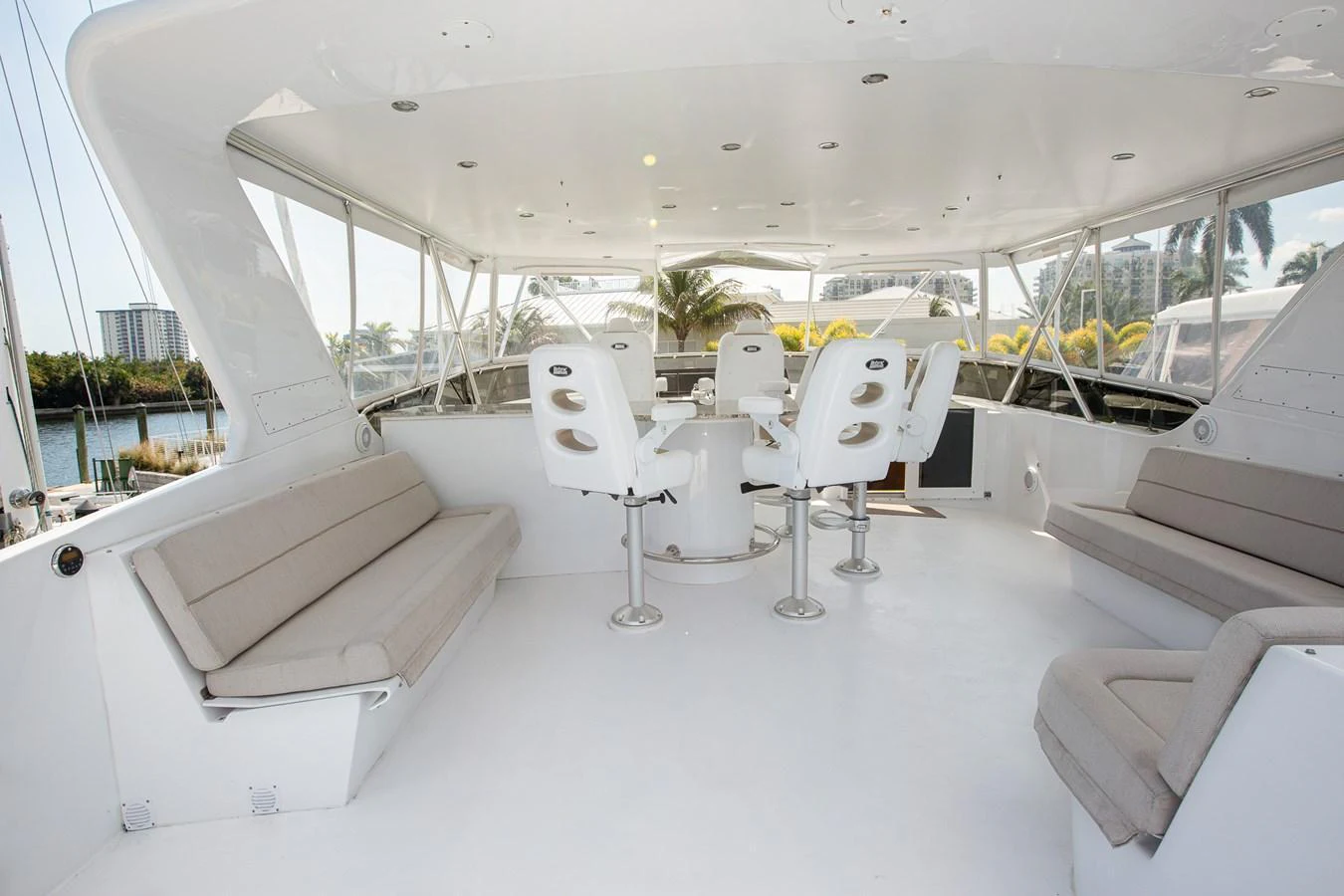 The flybridge offers a spacious and airy seating area with modern furnishings and panoramic views. aboard KRISTIN LEE Yacht for Sale