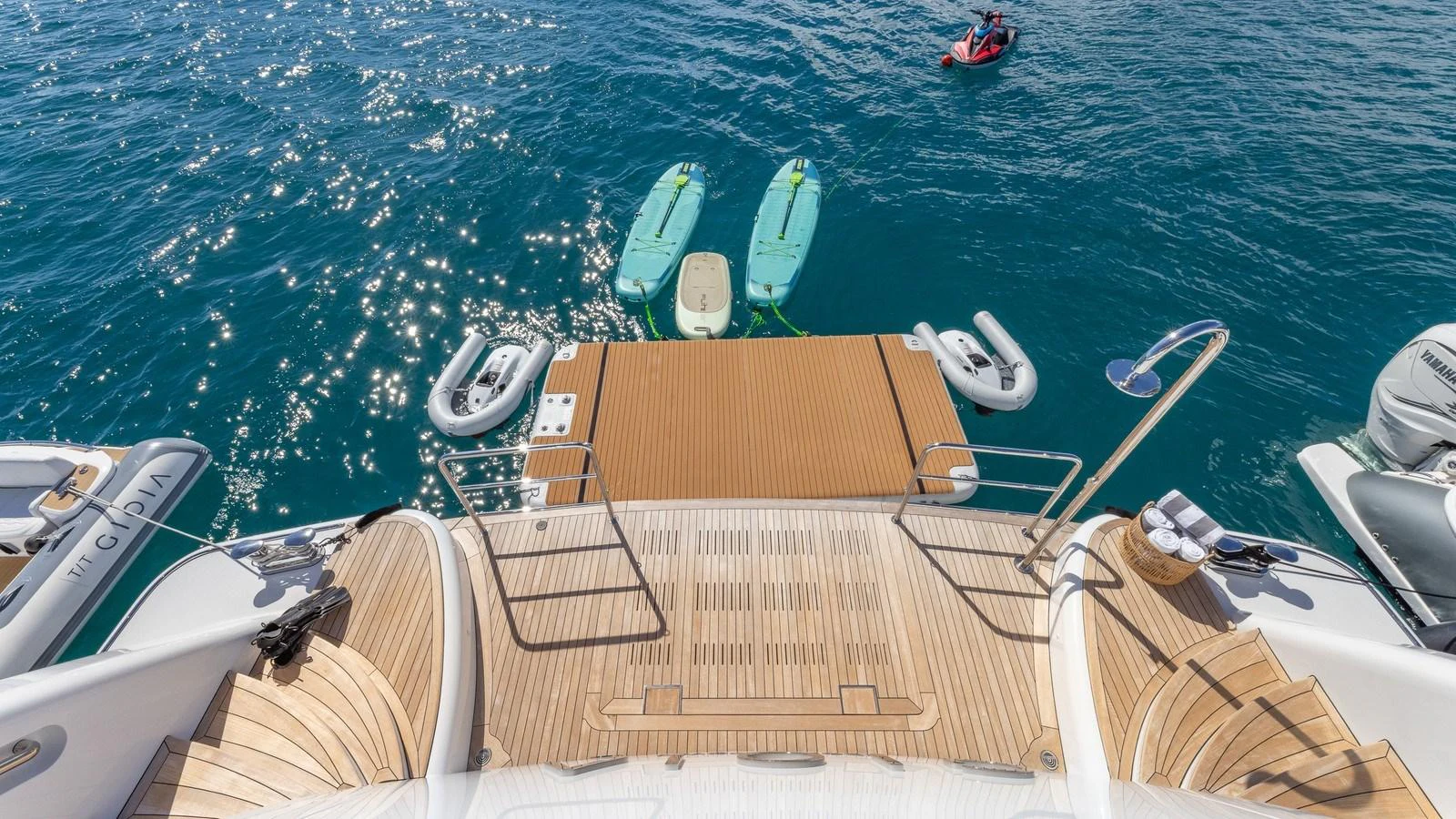 The yacht features a spacious swim platform with easy access to the water and various water toys. aboard GIOIA Yacht for Sale