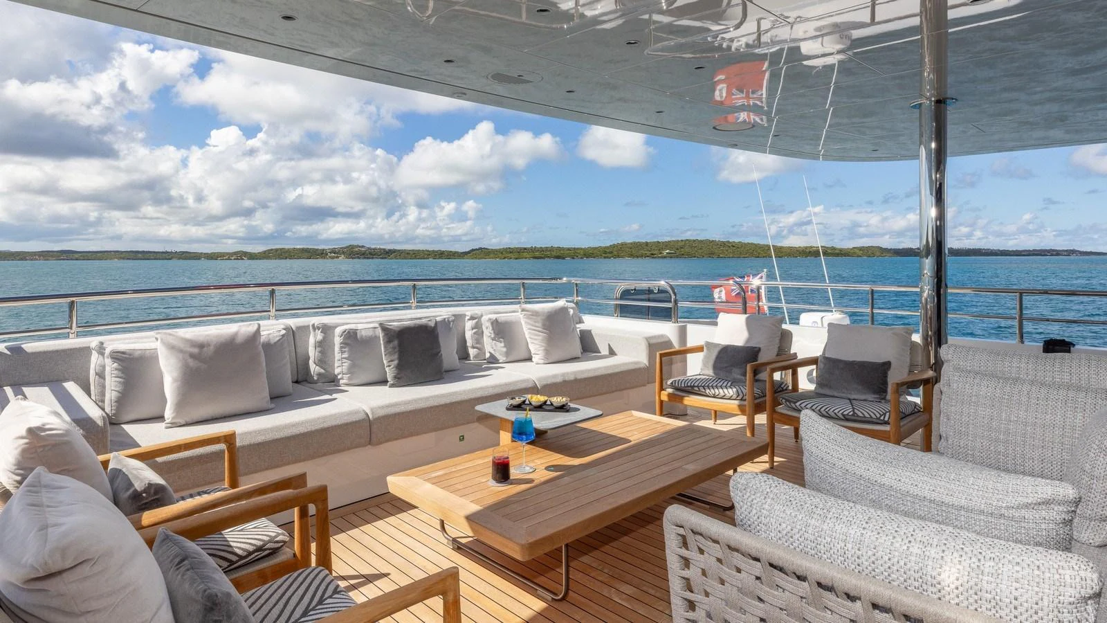 The aft deck offers a spacious and comfortable seating area with stunning views of the surrounding waters. aboard GIOIA Yacht for Sale