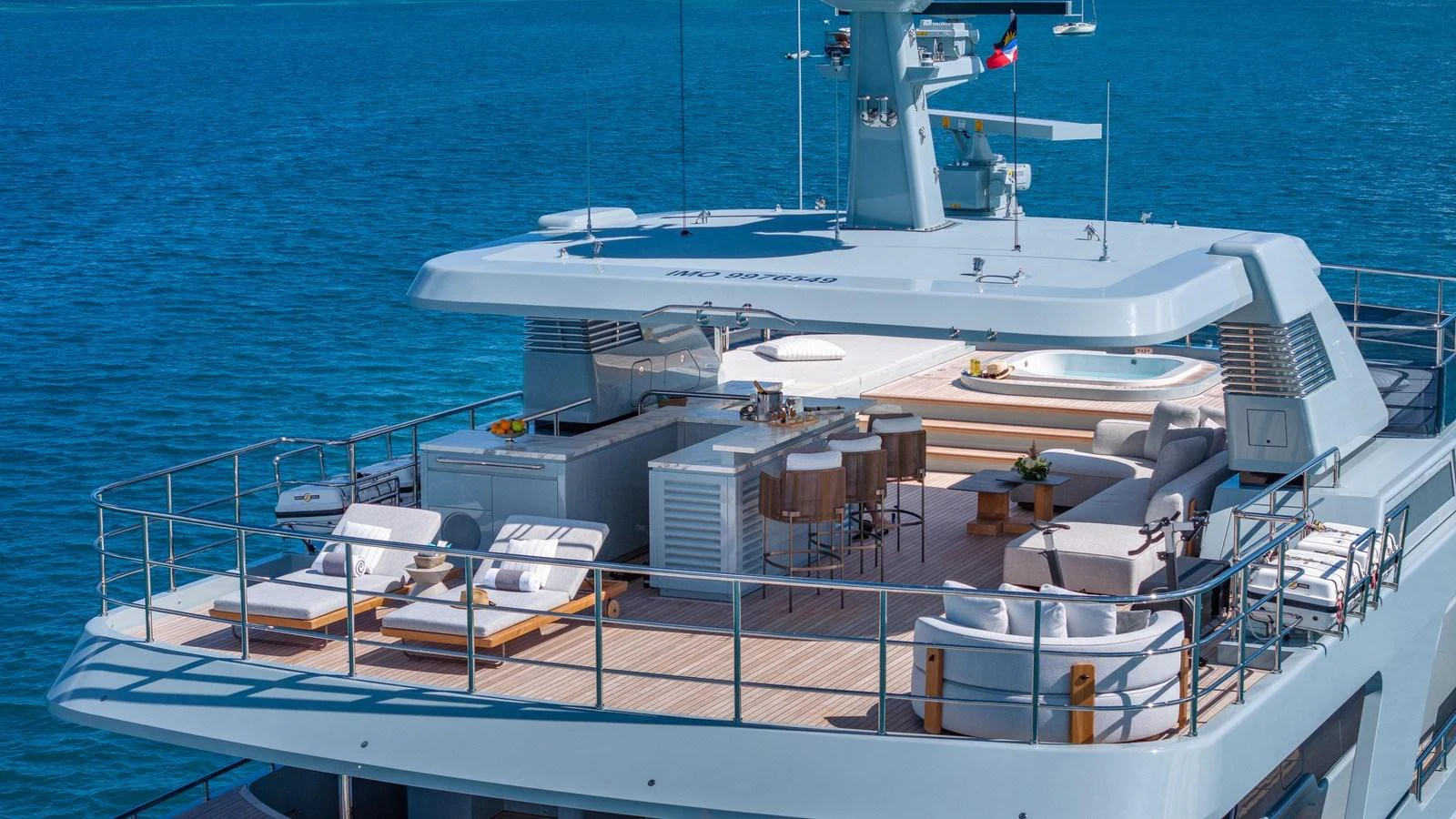 The sundeck offers a luxurious space for relaxation and entertainment with ample seating and a bar area. aboard GIOIA Yacht for Sale