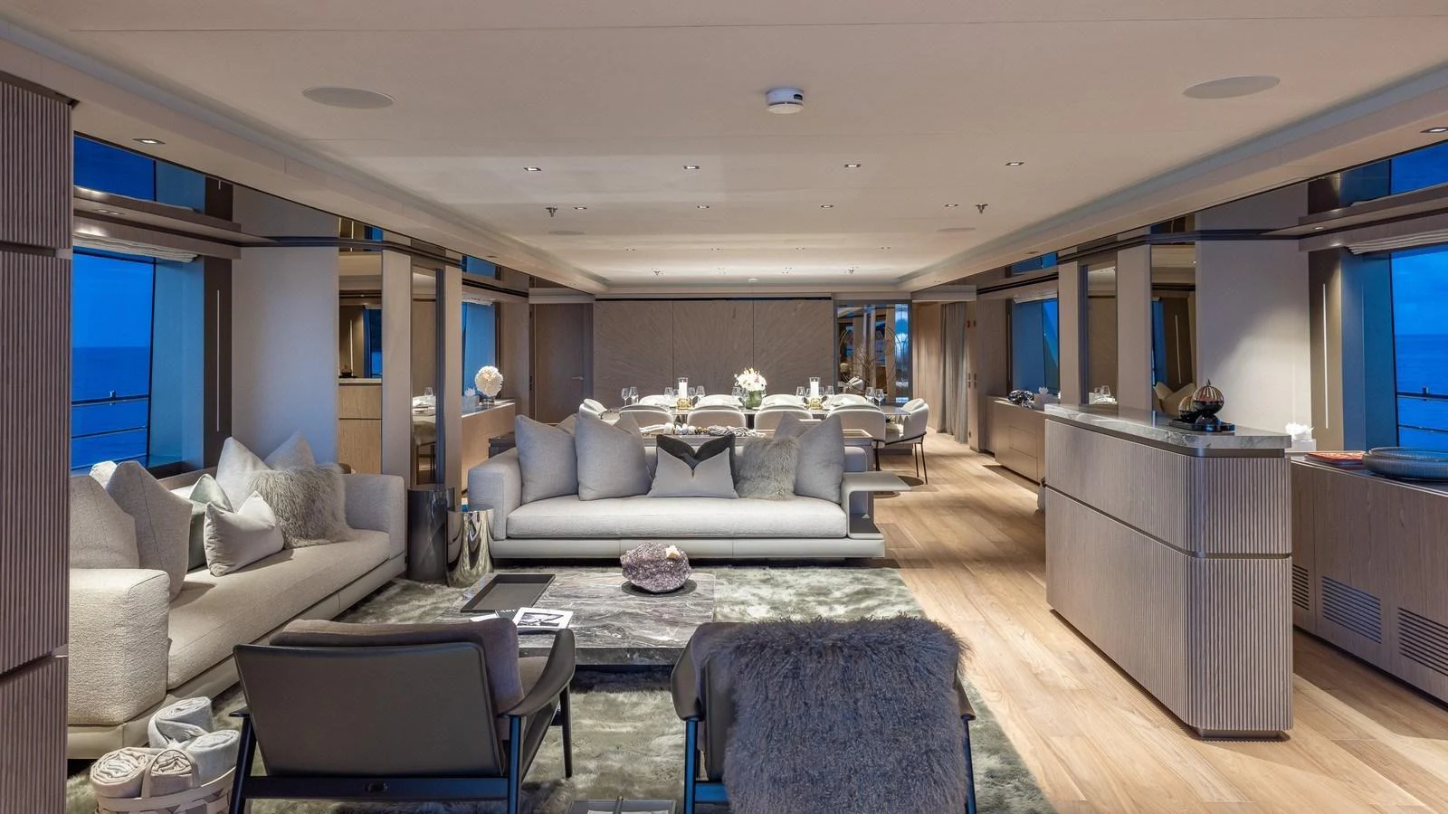 The spacious salon features elegant furnishings and panoramic windows for a luxurious and comfortable atmosphere. aboard GIOIA Yacht for Sale