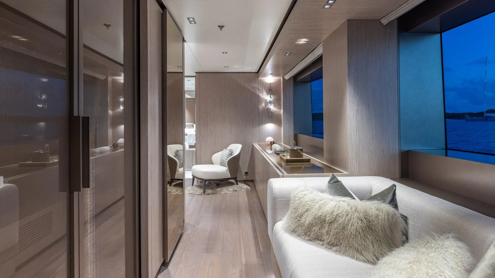 The yacht's interior features a modern, cozy lounge area with large windows offering stunning views. aboard GIOIA Yacht for Sale