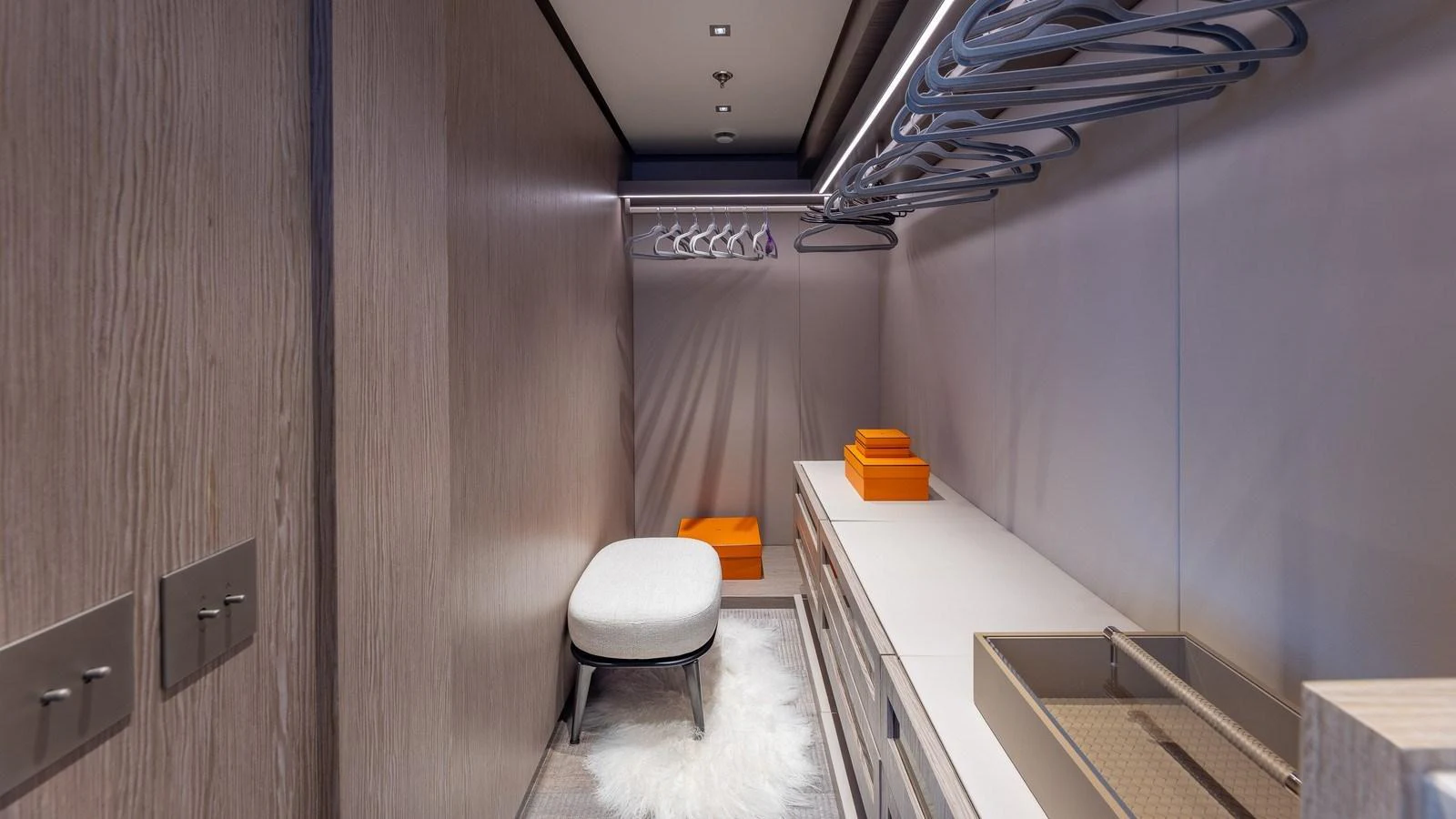 A spacious and well-organized yacht closet with modern fixtures and ample storage. aboard GIOIA Yacht for Sale